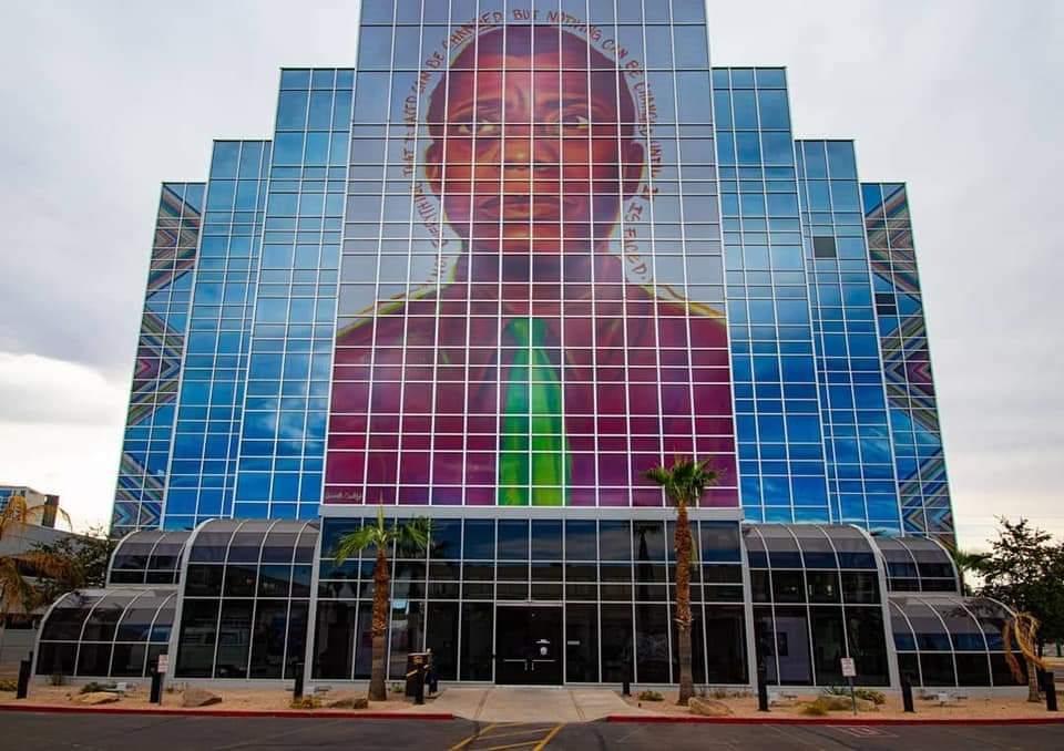 Antoinette Cauley's James Baldwin mural on a glass office building in downtown Phoenix