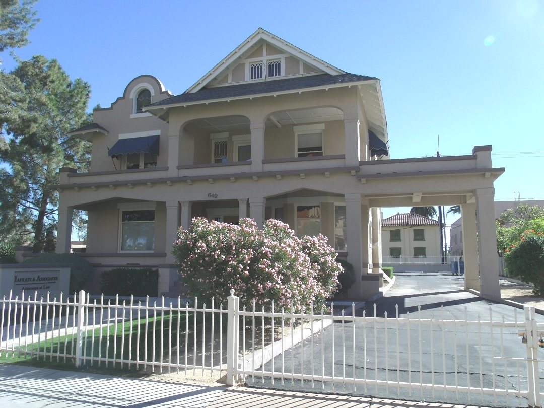 The DeMund House at 649 N 2nd Ave, with its deep porch and second-story balcony
